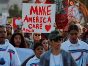 Demonstrators hold a "Lights for Liberty" rally march and vigil near the U.S. Mexico border crossing in the San Ysidro neighborhood of San Diego as they protest immigration enforcement being conducted by the U.S. government from San Diego, California