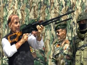 Defence Minister Rajnath Singh inspects a Pika machine gun