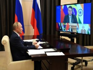 Russian President Putin attends the BRICS Summit via a video conference call outside Moscow