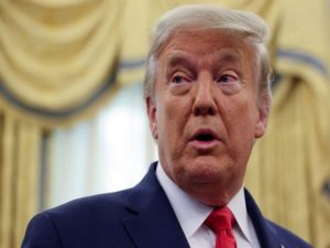 U.S. President Trump responds to a question from a reporter in the Oval Office at the White House in Washington