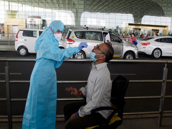 Medical Staff collects the swab sample for mandatory RT-PCR COVID-19 testing