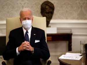 U.S. President Joe Biden accompanied by U.S. Vice President Kamala Harris and Treasury Secretary Janet Yellen (not pictured) attends a meeting with business leaders at the Oval Office of the White House in Washington, U.S.