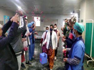 Medic workers being welcomed with a shower of rose petals