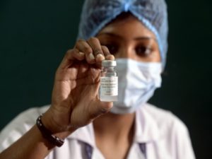 A health worker shows COVID 19 vaccine Covaxin at R. G. Kar Medical College and Hospital