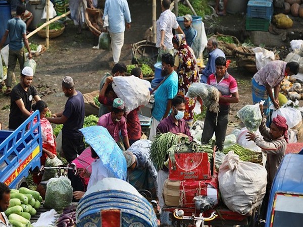 People are seen at a wholesale kitchen market after the government has eased restrictions amid concerns over coronavirus disease(COVID-19) outbreak in Dhaka