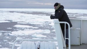 Ice navigator Paul Ruzycki of Canada looks on aboard the Greenpeace's "Arctic Sunrise" ship in the middle of the Arctic Ocean