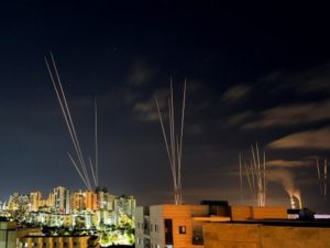 Streaks of light are seen as rockets are launched from the Gaza Strip towards central Israel as seen from Ashkelon, Israel