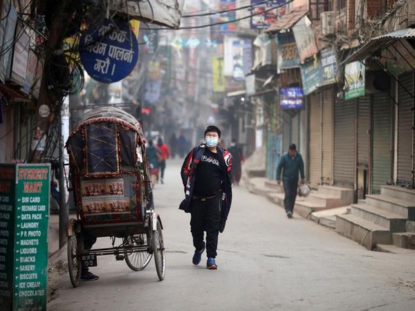 A man wears a mask as a preventive measure against the coronavirus outbreak, in Kathmandu