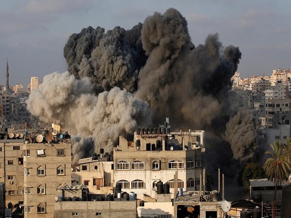 Smoke rises after an Israeli aircraft bombed a multi-storey building in Gaza City