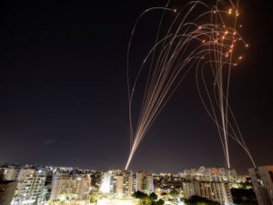 Streaks of light are seen as Israel's Iron Dome anti-missile system intercepts rockets launched from the Gaza Strip towards Israel, as seen from Ashkelon, Israel