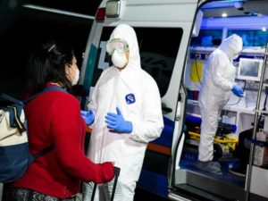 Salvadoran citizen is being examined at the Salvador International Airport before moving to quarantine upon arrival from China due the global coronavirus situation, in San Salvador