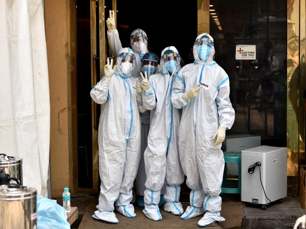 Nurses in a PPE kit shows victory sign on the occasion of International Nurses Day