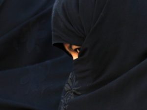 An Afghan woman attends an election campaign of Afghan presidential candidate Abdullah Abdullah in Chaghchran capital of Ghor province