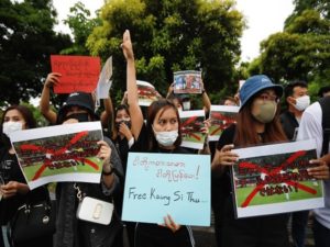 Myanmar protesters hold a rally before Japan v Myanmar soccer match, in Chiba