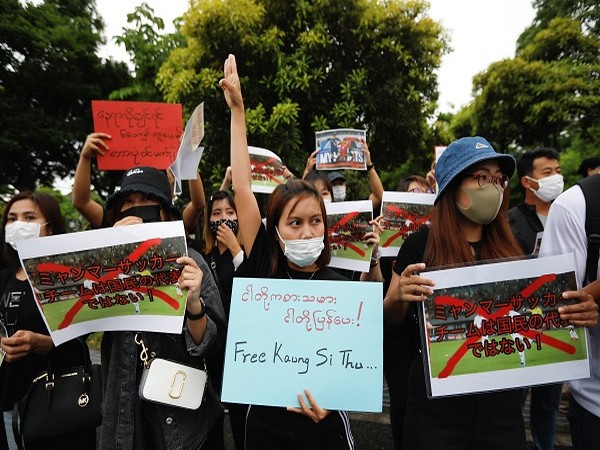 Myanmar protesters hold a rally before Japan v Myanmar soccer match, in Chiba