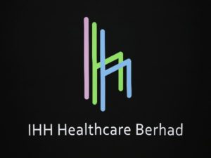 The logo of IHH Healthcare Berhad is seen at the Singapore Exchange before its listing