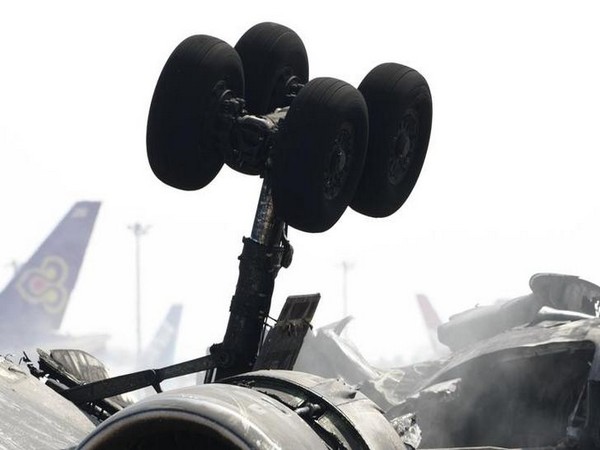 Rear tyres of a crashed cargo plane are seen at Narita international airport in Narita