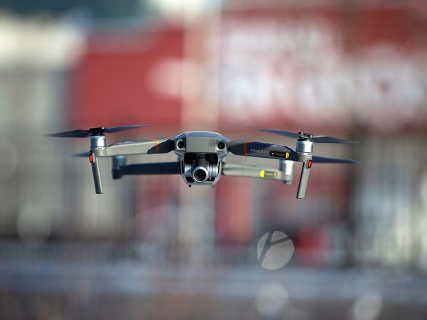 A drone flies as Chinese drone maker DJI demonstrates their app that tracks a drone's registration and owner in Montreal