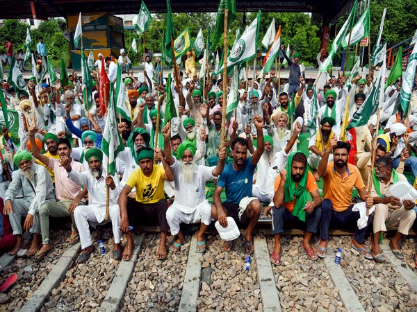 Farmers on railway tracks protest during the nationwide 'Bharat Bandh' called by Samyukt Kisan Morcha