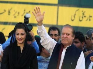 Nawaz Sharif, former Prime Minister and leader of Pakistan Muslim League, gestures to supporters as his daughter Maryam Nawaz looks on during party's workers convention in Islamabad