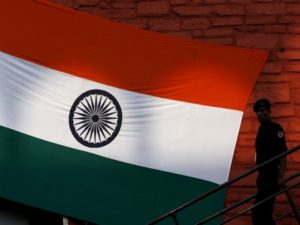 An Indian security commando leaves the historic Red Fort after the full-dress rehearsal for India's Independence Day celebrations in Delhi