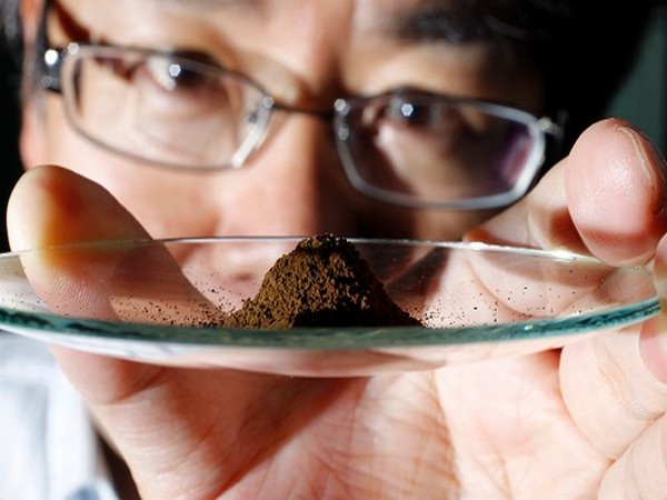 Kato, an associate professor of earth science at the University of Tokyo, displays a mud sample extracted from the depths of about 4,000 metres (13,123 ft) below the Pacific ocean surface in Tokyo