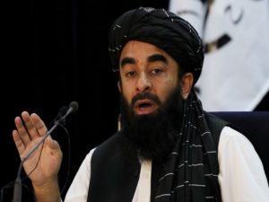 Taliban spokesman Zabihullah Mujahid speaks during a news conference in Kabul