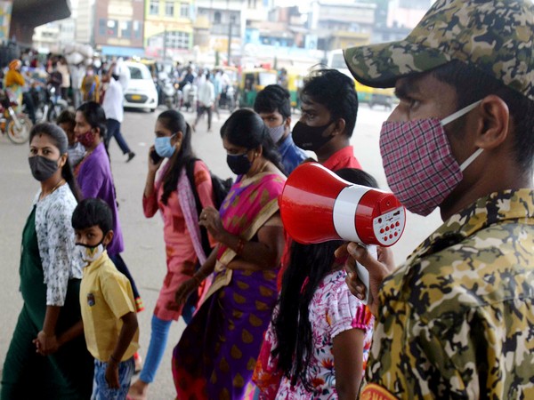 A BBMC marshal announcing to wear face masks, take Covid-19 vaccine, and follow Covid-appropriate behaviour