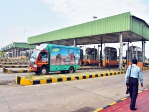 A security guard takes a vigil on the movements of vehicle at a Toll Plaza