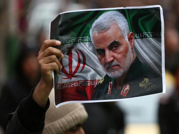 Iranian holds a picture of late General Qassem Soleimani in Tehran