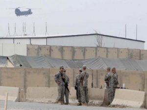 U.S. soldiers talk during a ceremonial handover of Imam Ali Air Base, known to U.S. as Camp Adder, to Iraqi security forces from U.S. military forces near Nassiriya