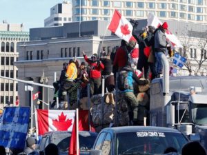 Truckers take part in a convoy and protest against COVID-19 vaccine mandate in Ottawa