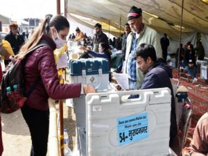 Polling officials collecting the Electronic Voting Machine (EVMs) and other necessary inputs