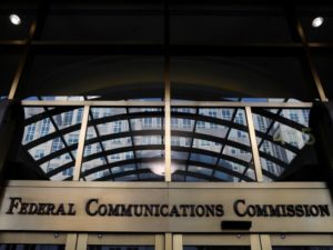 Signage is seen at the headquarters of the Federal Communications Commission in Washington, D.C.