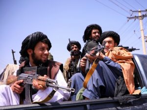 Taliban forces patrol in front of Hamid Karzai International Airport in Kabul