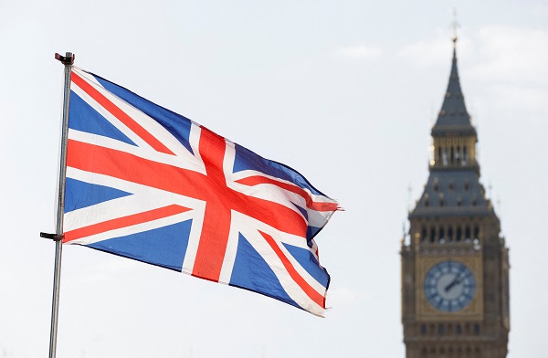 The Britain's national flag flies next to the Elizabeth Tower, commonly known as Big Ben, on national day of reflection to mark the two year anniversary of the UK going into national lockdown, in London