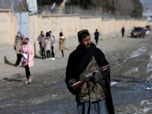 A Taliban fighter guards a street in Kabul