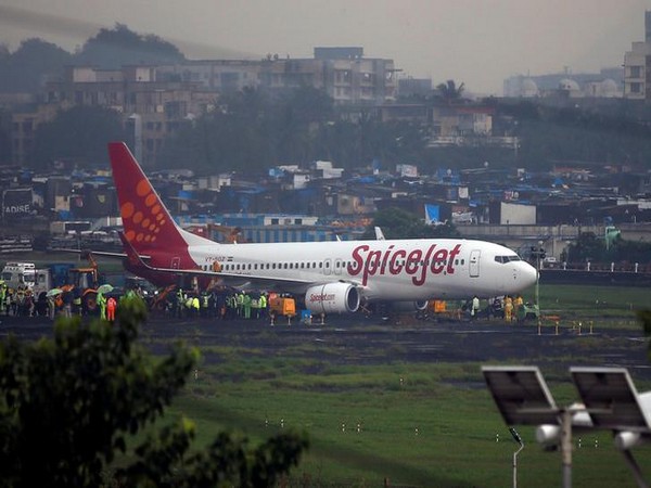 A SpiceJet passenger aircraft is seen after it overshoot the runway while landing on Tuesday night at the airport in Mumbai