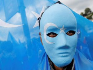 Ethnic Uighur demonstrators take part in a protest against China, in Istanbul