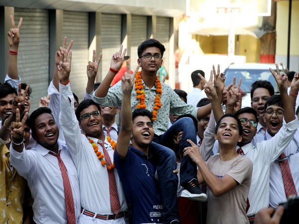 Students celebrate their success after the class 10th results of the ICSE Board were declared