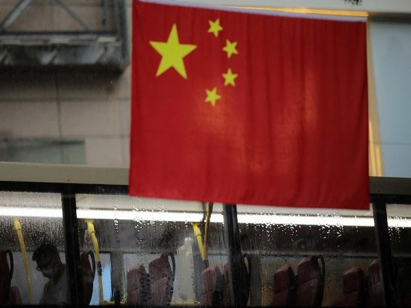 Chinese and Hong Kong flags decorate a street in Hong Kong