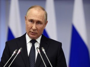 Russian President Vladimir Putin delivers a speech during a meeting of the Council of Legislators at the Federal Assembly in Saint Petersburg