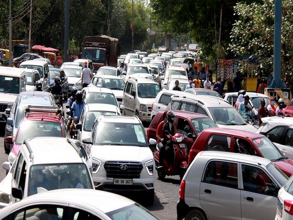 Heavy traffic jam as people wait in their cars during drive-through COVID-19 vaccination