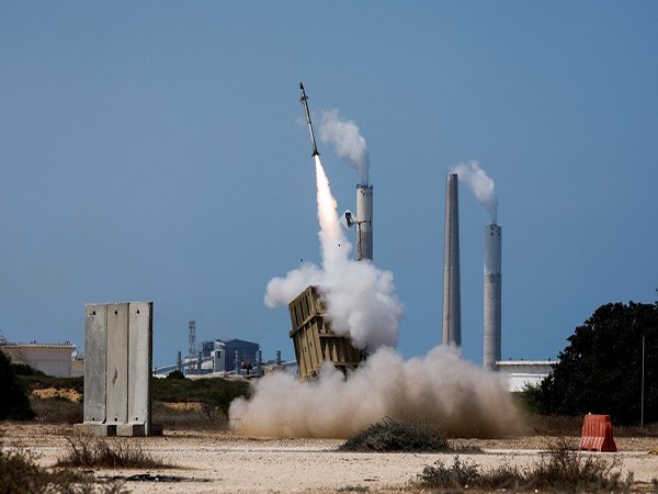 An Iron Dome anti-missile system fires an interceptor missile as a rocket is launched from the Gaza Strip towards Israel