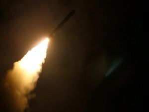 The guided-missile destroyer USS Laboon fires a Tomahawk land attack missile