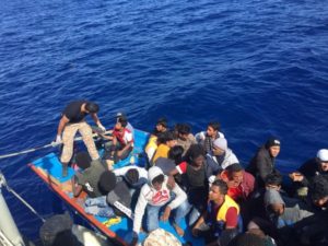 Migrants are seen in a dinghy as they are rescued by Libyan coast guards at the Mediterranean Sea off the coast of Libya