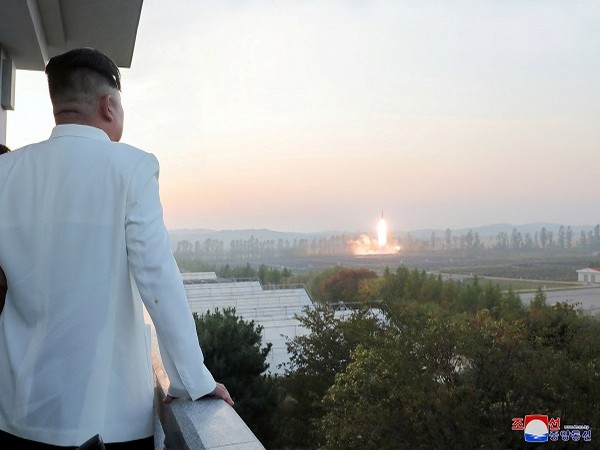 North Korea's leader Kim Jong Un oversees a missile launch at an undisclosed location in North Korea