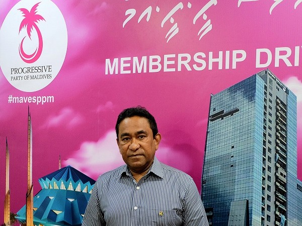 Abdulla Yameen poses for a photo at his party office in Male