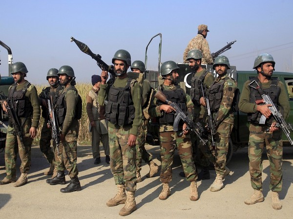 Soldiers gather outside Bacha Khan University where an attack by militants took place, in Charsadda, Pakistan