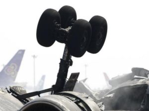 Rear tyres of a crashed cargo plane are seen at Narita international airport in Narita